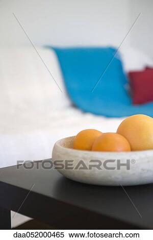 Stock Photography - Fruit bowl on coffee table. Fotosearch