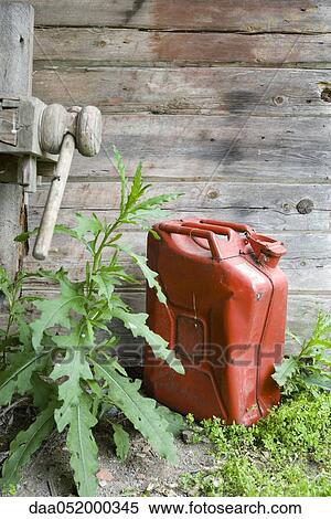 Gas can on ground outdoors View Large Photo Image Stock Photography - Gas can on ground outdoors. Fotosearch