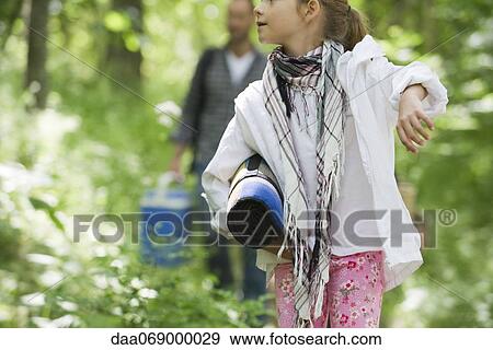 Girl walking in woods, cropped View Large Photo Image Stock Photo - Girl walking in woods, cropped. Fotosearch