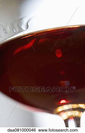 Stock Photograph - Glass of red wine, close-up. Fotosearch