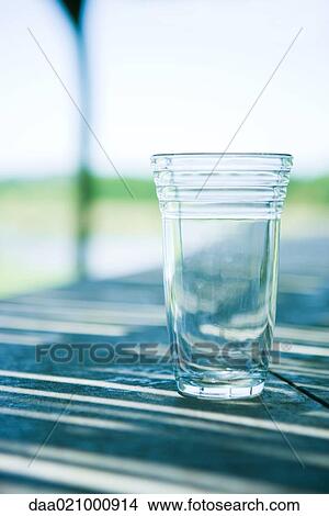 Glass on table View Large Photo Image Picture - Glass on table. Fotosearch