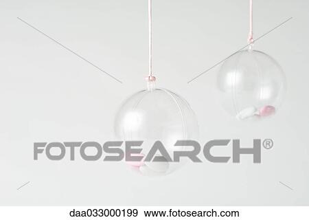 Glass ornaments containing candy, close-up View Large Photo Image Stock Photo - Glass ornaments containing candy, close-up. Fotosearch