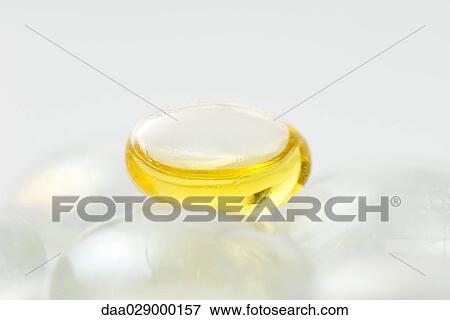 Stock Photo - Glass pebbles, close-up, focus on yellow pebble. Fotosearch