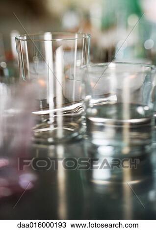 Glasses on table View Large Photo Image Stock Image - Glasses on table. Fotosearch