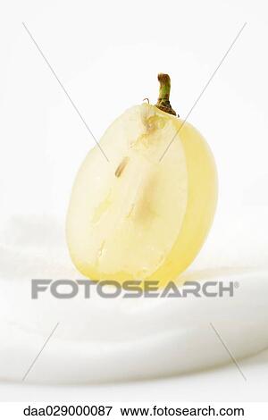 Grape half on cotton cosmetic pad View Large Photo Image Stock Photo - Grape half on cotton cosmetic pad. Fotosearch