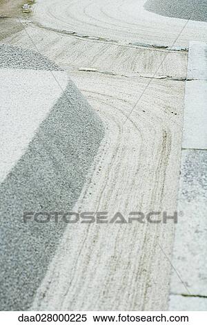 Gravel mounds and patterns in rock garden View Large Photo Image Stock Photography - Gravel mounds and patterns in rock garden. Fotosearch