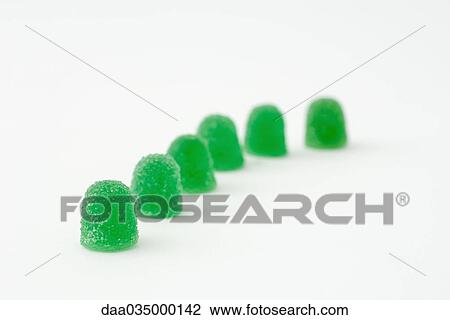 Green gum drops in a line View Large Photo Image Stock Image - Green gum drops in a line. Fotosearch