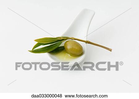 Green olive in spoon, leaf garnish View Large Photo Image Stock Photo - Green olive in spoon, leaf garnish. Fotosearch