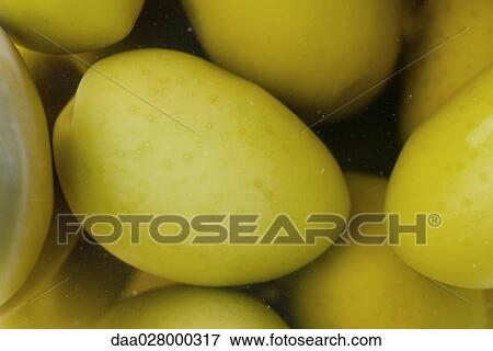 Stock Photo - Green olives, close-up, full frame. Fotosearch
