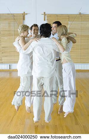 Group of adults holding onto each others' shoulders, jumping View Large Photo Image Stock Image - Group of adults holding onto each others' shoulders, jumping. Fotosearch