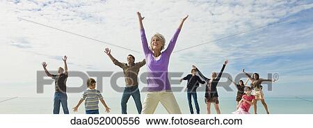 Group of people jumping with joy View Large Photo Image Stock Photograph - Group of people jumping with joy. Fotosearch