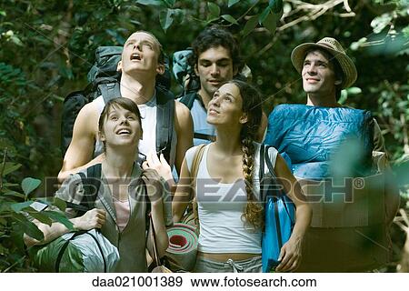 Group of wilderness campers carrying equipment, looking up View Large Photo Image Stock Photo - Group of wilderness campers carrying equipment, looking up. Fotosearch