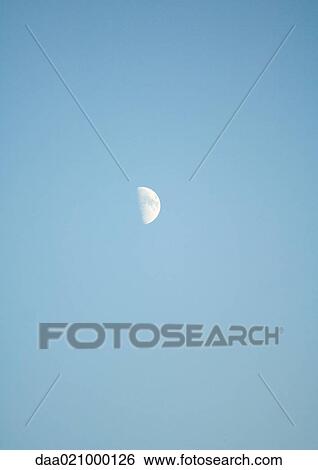 Half moon in blue sky View Large Photo Image Stock Photograph - Half moon in blue sky. Fotosearch
