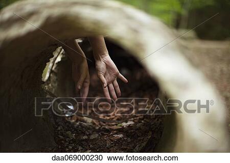 Hands, seeing through concrete pipe View Large Photo Image Stock Image - Hands, seeing through concrete pipe. Fotosearch