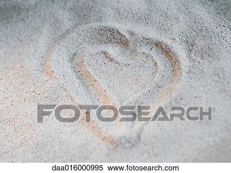 Stock Photography - Heart drawn in sand. Fotosearch