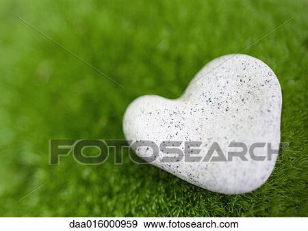 Heart-shaped stone on moss View Large Photo Image Stock Photo - Heart-shaped stone on moss. Fotosearch