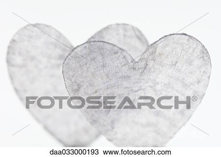 Stock Image - Heart shapes made of glass, heavily scratched. Fotosearch