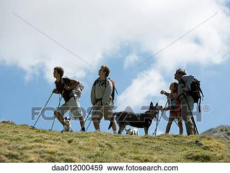 Hikers looking up View Large Photo Image Stock Photo - Hikers looking up. Fotosearch