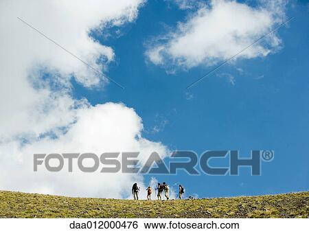 Stock Photograph - Hikers, low angle view. Fotosearch