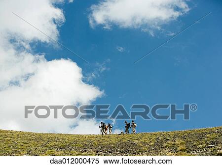 Stock Photography - Hikers, low angle view. Fotosearch