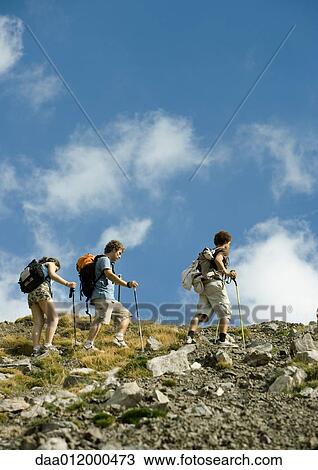 Hikers on mountainous landscape View Large Photo Image Stock Image - Hikers on mountainous landscape. Fotosearch
