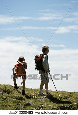 Stock Image - Hikers taking break. Fotosearch