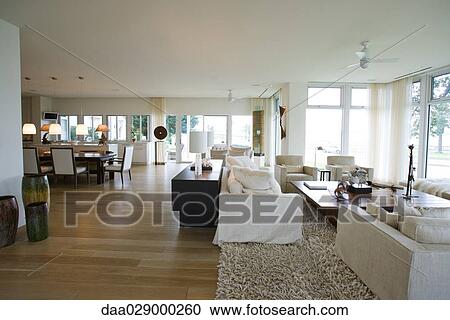 Home interior with living room opening into dining room View Large Photo Image Stock Image - Home interior with living room opening into dining room. Fotosearch