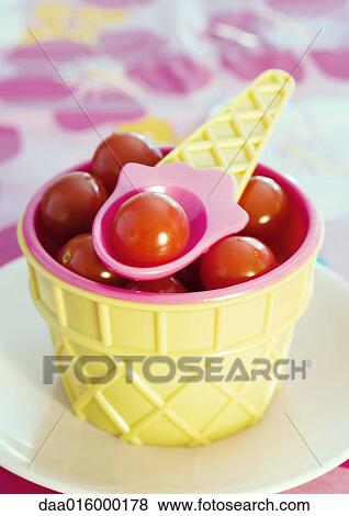 Ice cream cone shaped dish containing cherry tomatoes View Large Photo Image Stock Photo - Ice cream cone shaped dish containing cherry tomatoes. Fotosearch