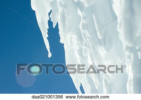 Ice formation, blue sky in background View Large Photo Image Stock Photograph - Ice formation, blue sky in background. Fotosearch