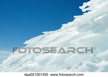Ice formation, blue sky in background View Large Photo Image Stock Photography - Ice formation, blue sky in background. Fotosearch