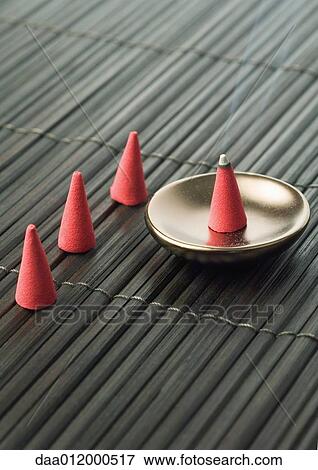 Incense cone burning View Large Photo Image Stock Photo - Incense cone burning. Fotosearch