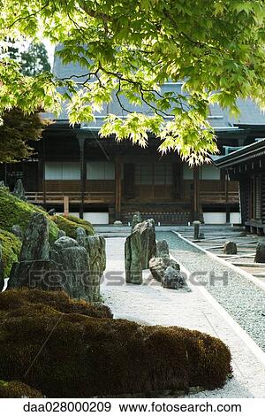 Stock Photo - Japanese rock garden and traditional building. Fotosearch