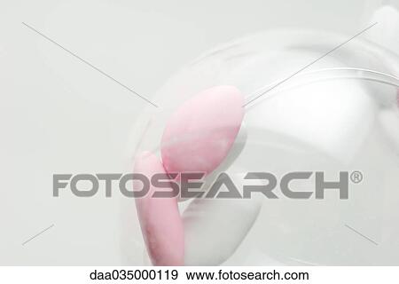 Jordan almonds in plastic container View Large Photo Image Stock Photo - Jordan almonds in plastic container. Fotosearch