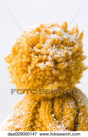 Knit hat dusted with snow, close-up of pompom View Large Photo Image Stock Photo - Knit hat dusted with snow, close-up of pompom. Fotosearch