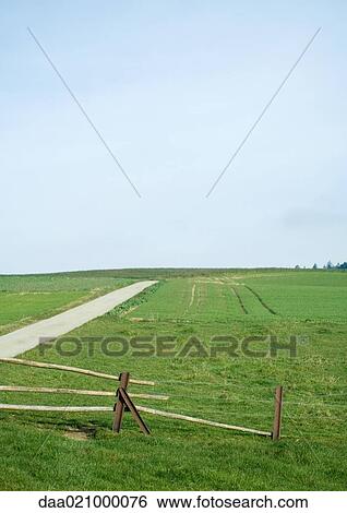 Stock Photograph - Landscape with wooden fence. Fotosearch