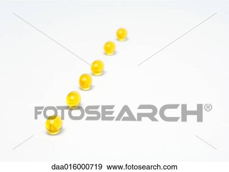 Line of evening primrose oil gelcaps View Large Photo Image Stock Photo - Line of evening primrose oil gelcaps. Fotosearch