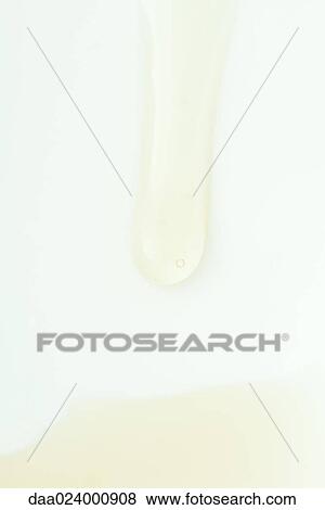Stock Photo - Liquid running across surface, extreme close-up. Fotosearch