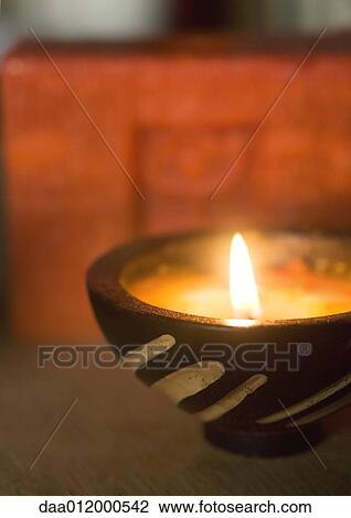 Stock Image - Lit candle. Fotosearch