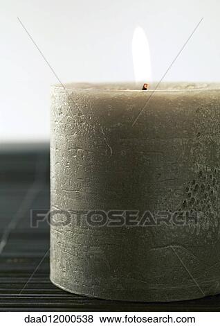 Stock Photo - Lit candle. Fotosearch