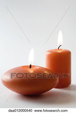 Stock Image - Lit candles. Fotosearch