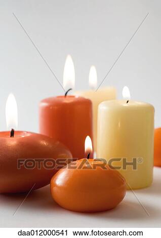 Stock Image - Lit candles. Fotosearch