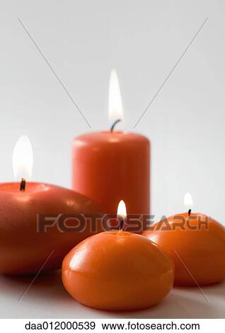 Stock Photo - Lit candles. Fotosearch