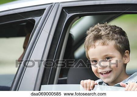 Little boy looking out car window, portrait View Large Photo Image Stock Photography - Little boy looking out car window, portrait. Fotosearch
