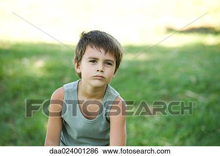 Little boy outdoors, looking away, portrait View Large Photo Image Stock Photograph - Little boy outdoors, looking away, portrait. Fotosearch