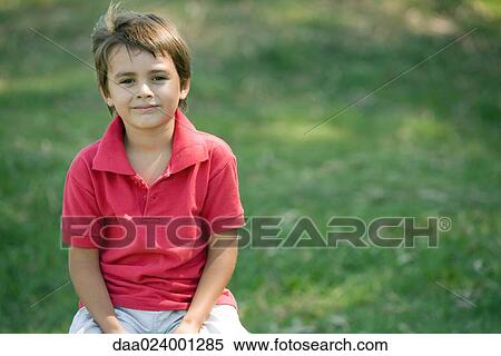 Little boy outdoors, smiling at camera, portrait View Large Photo Image Stock Photography - Little boy outdoors, smiling at camera, portrait. Fotosearch