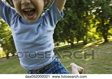 Little boy spinning, cropped View Large Photo Image Stock Image - Little boy spinning, cropped. Fotosearch