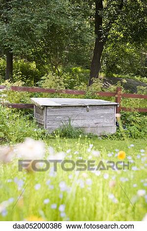 Stock Photograph - Locked storage crate in backyard. Fotosearch