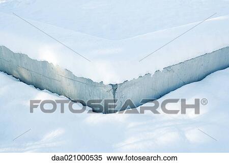 Stock Photography - Low concrete wall in snow. Fotosearch