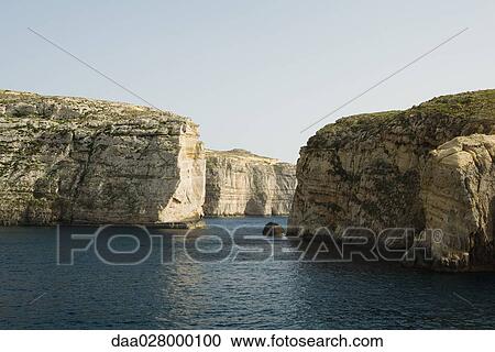 Malta, coastal landscape with cliffs View Large Photo Image Stock Image - Malta, coastal landscape with cliffs. Fotosearch