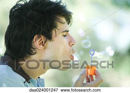 Man blowing bubbles View Large Photo Image Stock Photo - Man blowing bubbles. Fotosearch